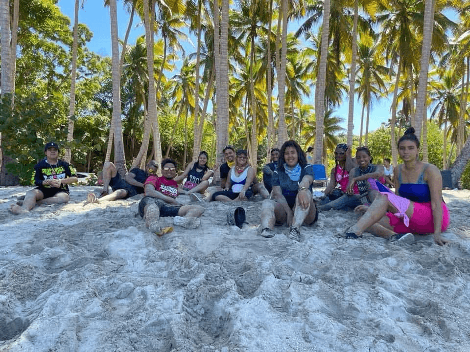 Family and friends relaxing beneath the palms
